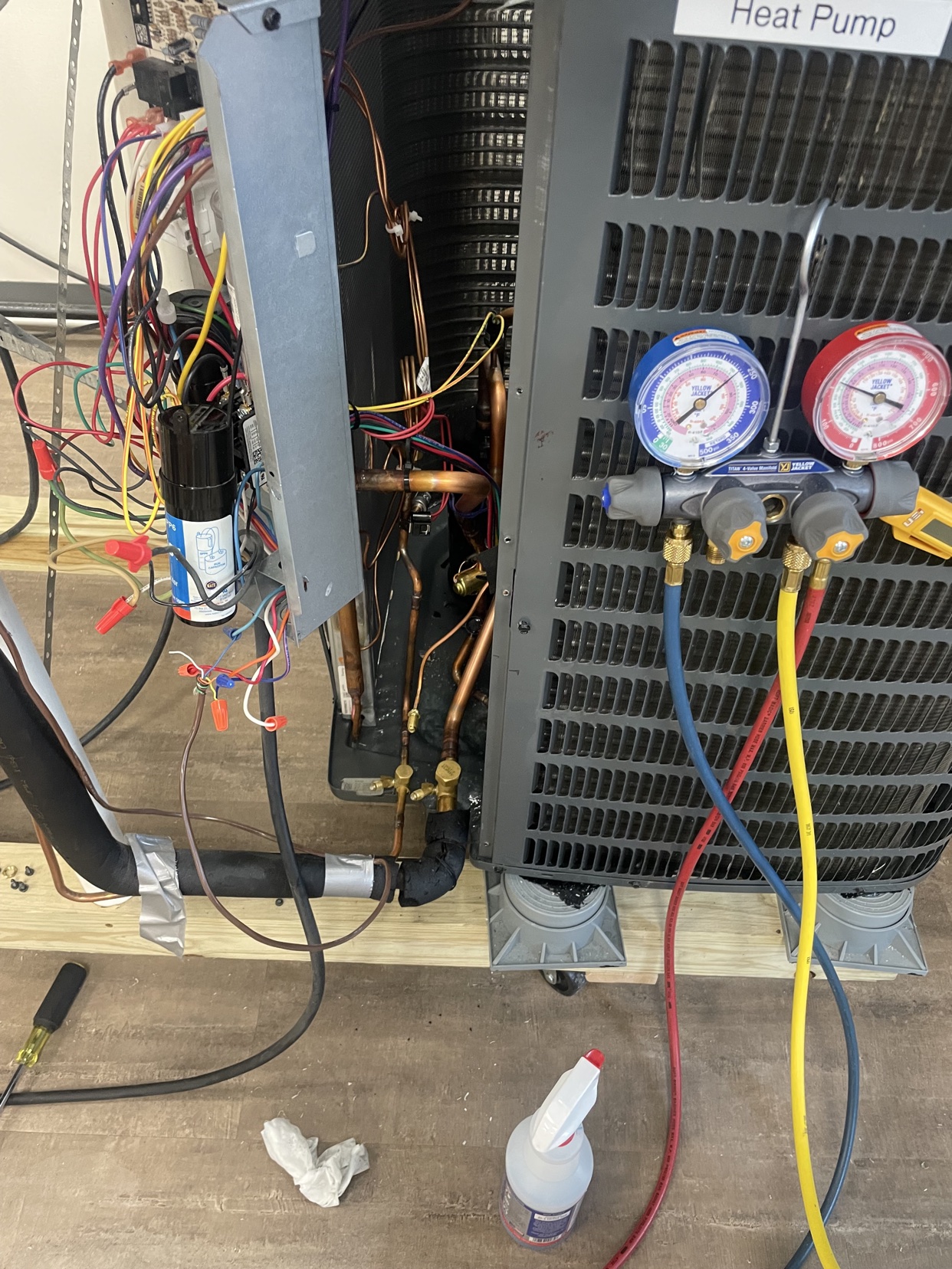 Heat pump service with manifold gauges